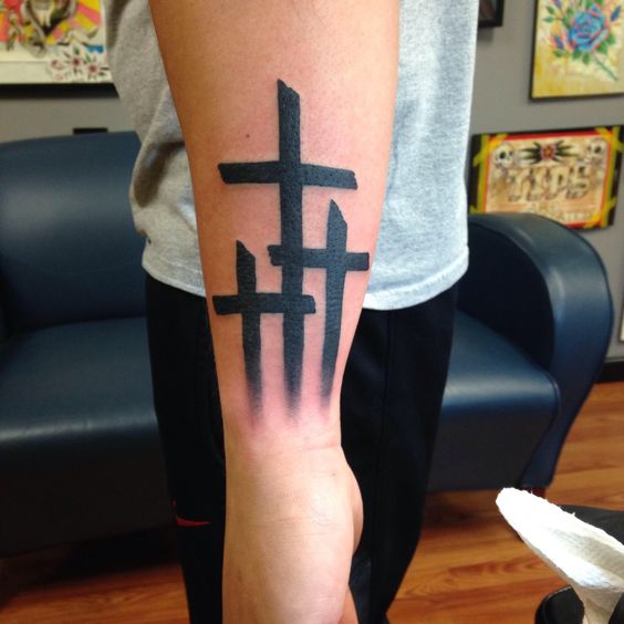 Forearm 3-cross tattoo is popular and never getting old tattoo idea