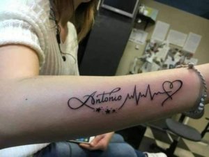 Heartbeat tattoo with a name is powerful and astonishing tattoo idea 5