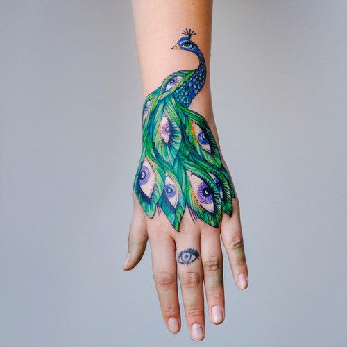 Here are 20 the sweetest peacock tattoo designs 2