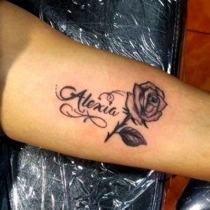 If you really love your partner get a rose tattoo with name 5
