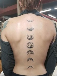 Spine moon phases tattoo is awesome and genuine idea for your next tattoo 2