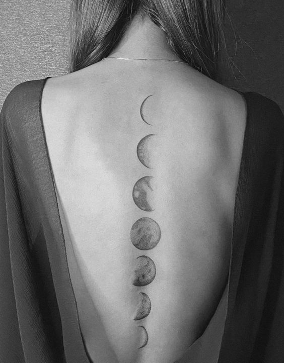 Fine line moon phases tattoo on the back