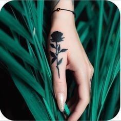 Stunning small black rose tattoo designs 2
