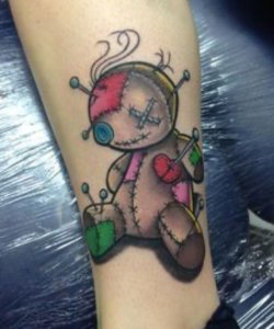 10 Mind blowing almost scary voodoo doll tattoos 9