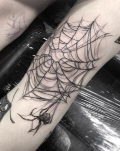 Be adorable with a spider web tattoo on a knee 5