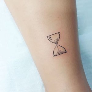Did you know that simple hourglass tattoo can look so badass 2