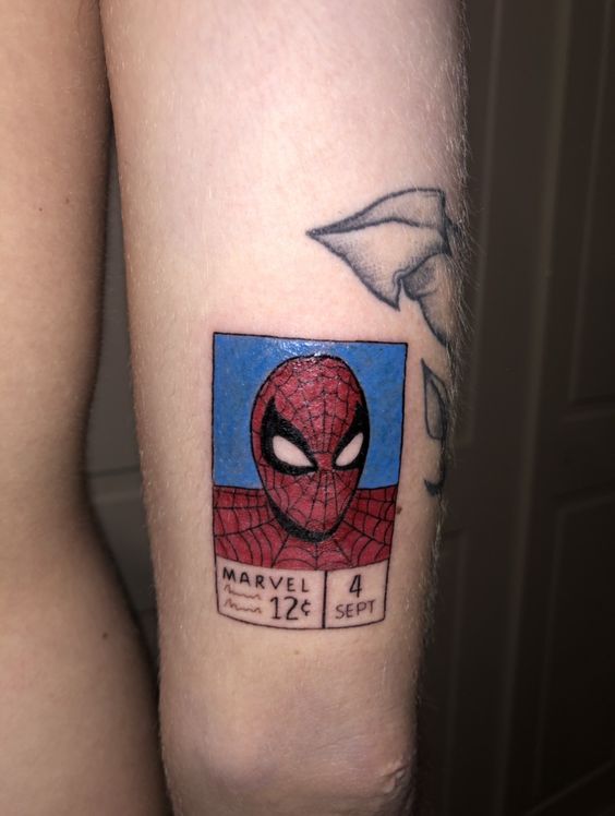 Forearm tattoo of the face of spiderman by Jay Shin