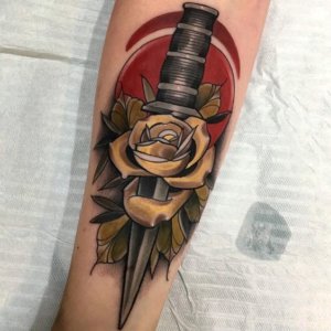 Forearm is popular place for dagger tattoo for boys and girls 4