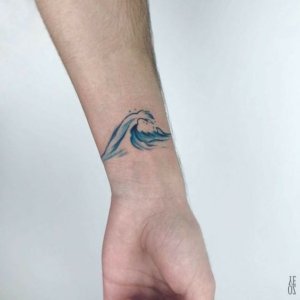 Inspiration of stunning wave tattoos on wrist 5