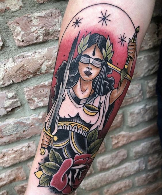 Keep to traditions and be gorgeous with traditional Lady Justice tattoo