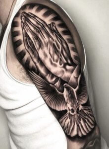 No mistake with praying hands shoulder tatto 2
