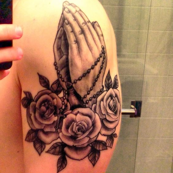 Rosary with a praying hands is a great tattoo motive