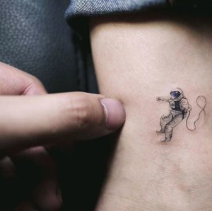 Space is incredible but so is small astronaut tattoo 3