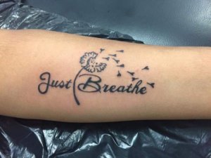 Take things lightly and make impressive Just breathe lettering tattoo 2