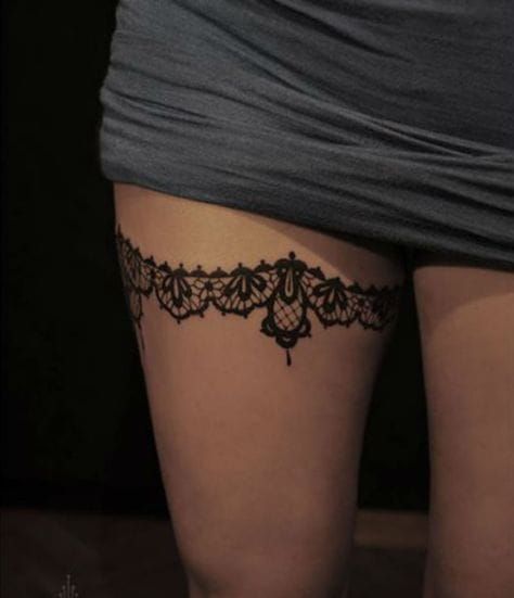 Be irresistible with lace garter thigh tattoo
