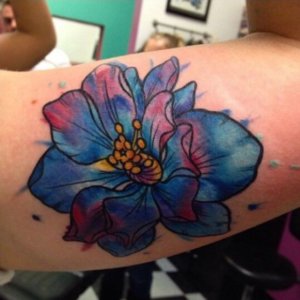 Ideas to be unique by getting lovely watercolor larkspur tattoo 1