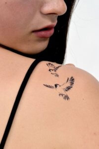 If you want a fascinating tattoo try a sparrow shoulder tattoo 1
