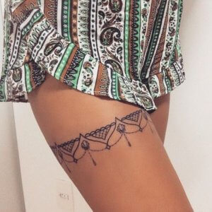 Make your body even sexier with these garter tattoo ideas for thigh 2