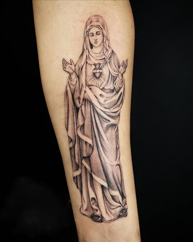 Forearm Virgin Mary tattoo with raised hands