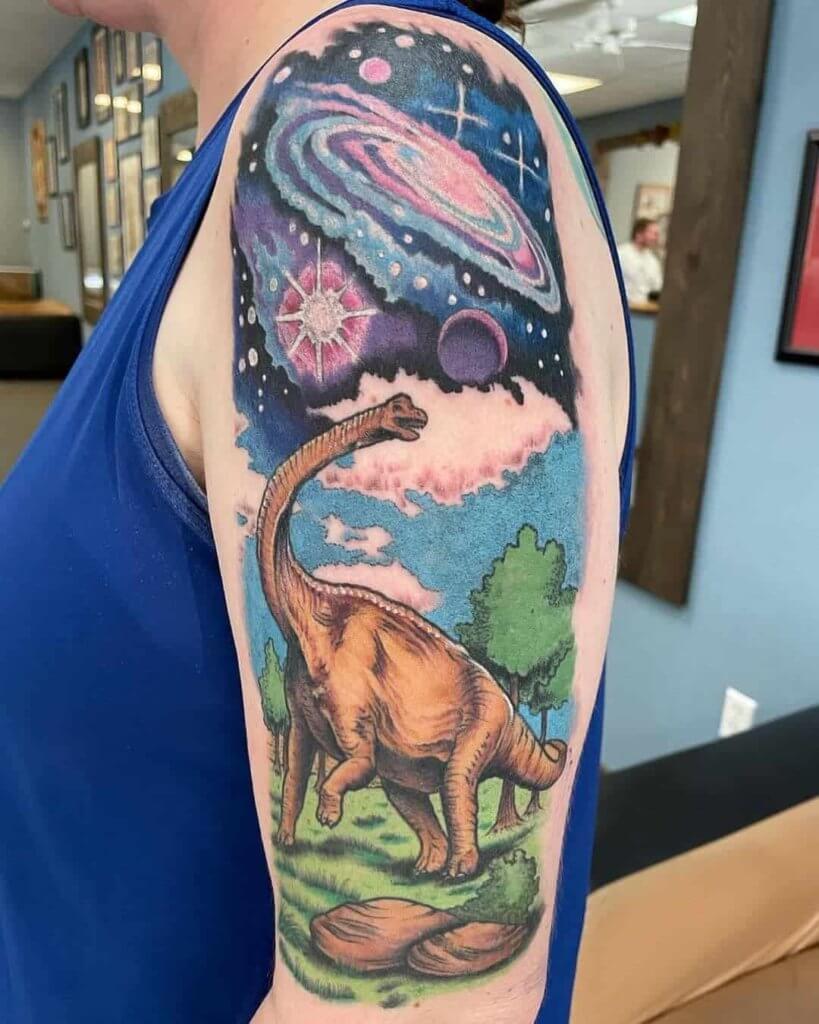 Shoulder dinosaur tattoo