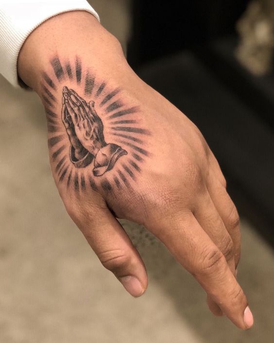 Meaning of praying hands tattoo and some examples 1