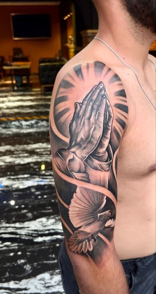 Meaning of praying hands tattoo and some examples 7