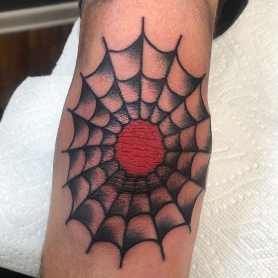 Elbow spider web tattoo
