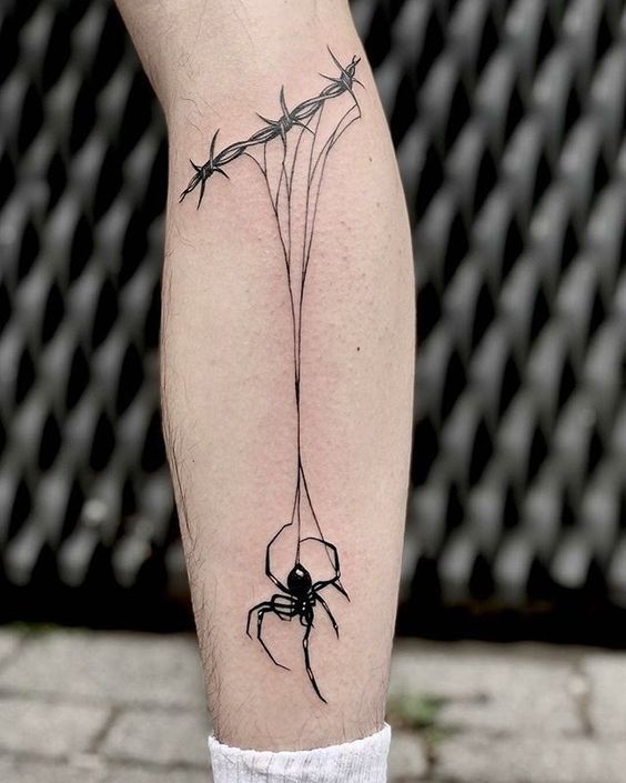 Calf spider web tattoo with spider