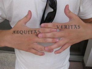 Some really incredible hand tattoos inked using boondock saints font 2
