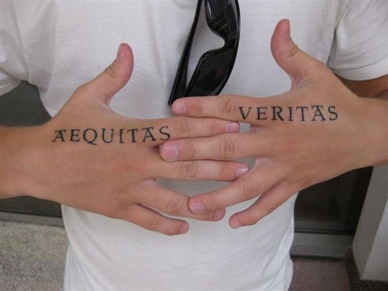 Some really incredible hand tattoos inked using boondock saints font