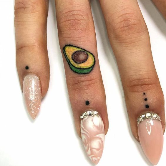 These are really lovely minimalist avocado tattoos you should absolutely check