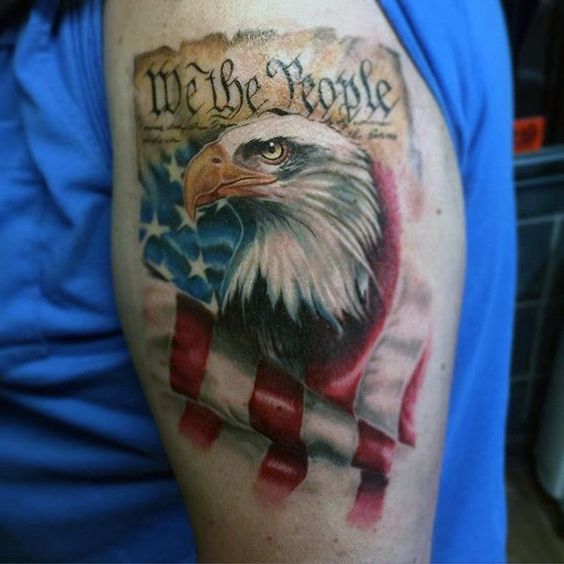 Bicep We the People tattoo with a flag and eagle