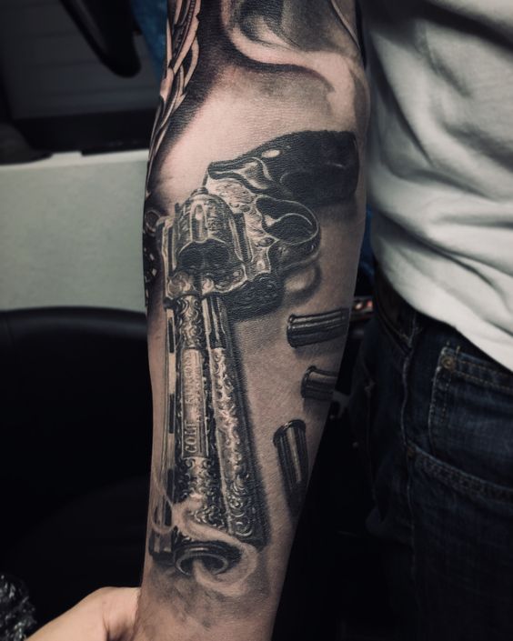 Forearm Chicano gun tattoo