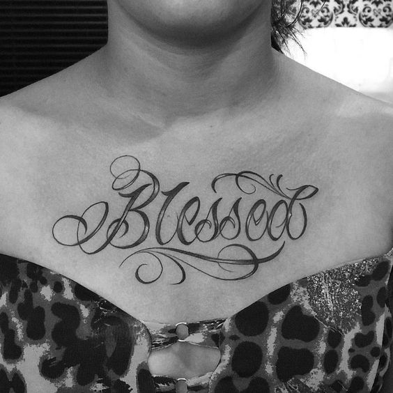 Blessed tattoo on the chest is a meaningful lettering tattoo