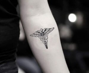 Caduceus tattoo as medical symbol on your body 3