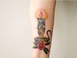 Flicker of tradition candle tattoos that light the way in 20 ideas 11