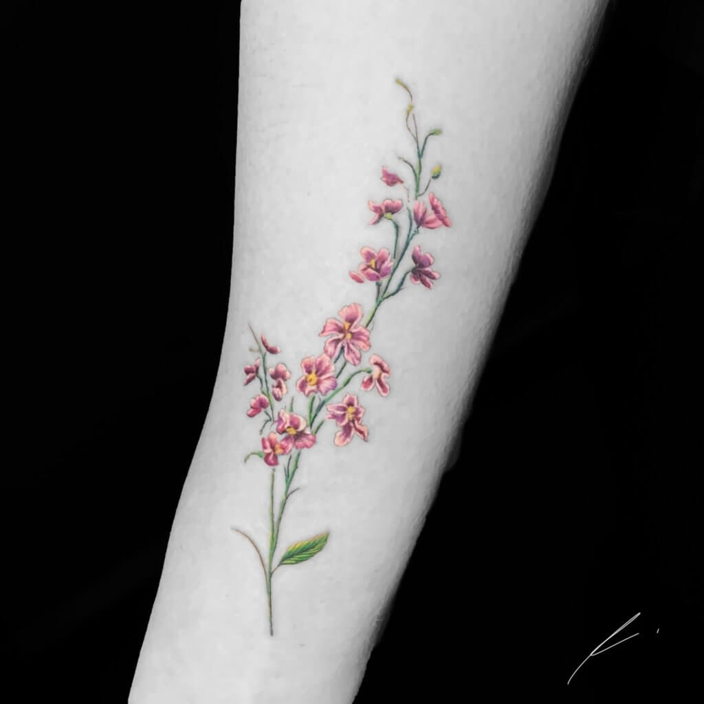 Red Larkspur forearm tattoo