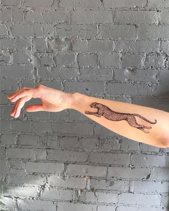 Jaguar tattoo on forearm
