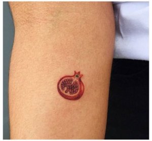Why are minimalist pomegranate tattoos so astonishing Check these ideas 5