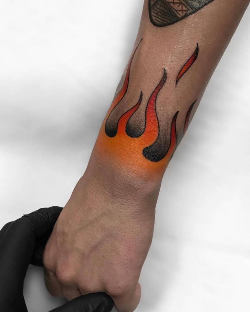 Fire ring tattoo located on the finger, minimalistic