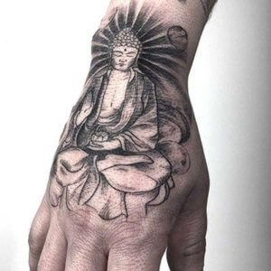 10 unique Buddha tattoos on hand as inspiration for your next piece 2