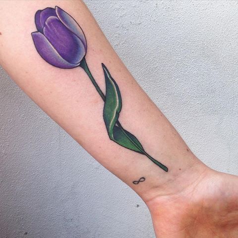 15 Spring-Inspired tulip tattoo on the forearm