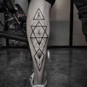 15 Symmetrical geometric calf tattoos as a perfectly balanced design 2