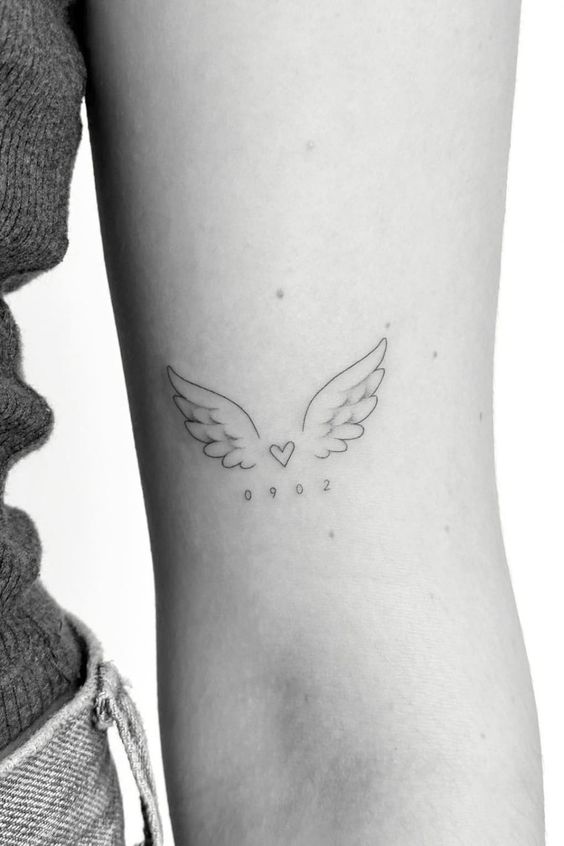 15 examples Angel wings tattoo on arm as symbol of protection