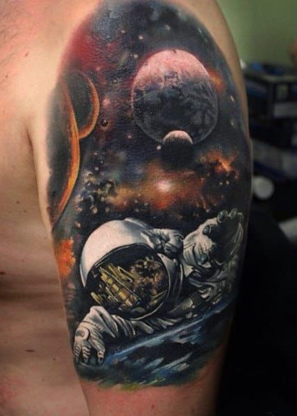 15 galactic ideas with astronaut tattoos featuring the beauty of the universe