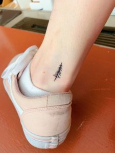Clean and simple pine tree tattoo for your body 2