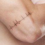 Eternal heartbeat as meaningful tattoo on the arm in 15 ideas