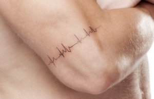 Eternal heartbeat as meaningful tattoo on the arm in 15 ideas 1