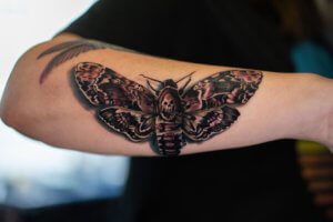 Realistic death moth tattoo as dark and mystical representation 4