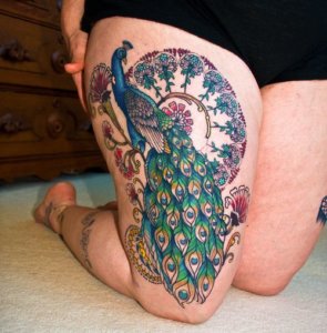 10 stunning peacock tattoos on the thigh a symbol of beauty and grace 10